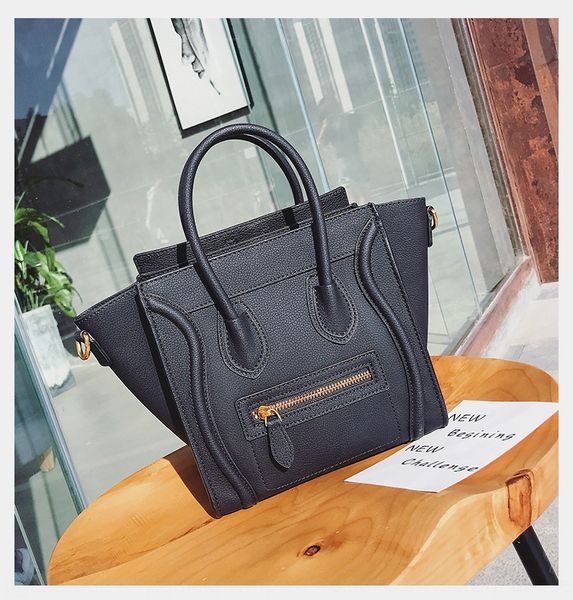 

anqw7 fashion smile face 2020 new leather hand women's hand handbag solid bag