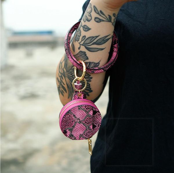 

2020 trendy leather tassel snakeskin earphone bag wristlet keychains, Black