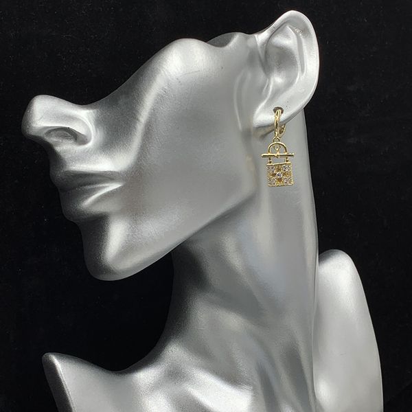 

high-endeuropean and american small gold lock earrings full of diamond hollow four leaf flower buckle ins, Silver