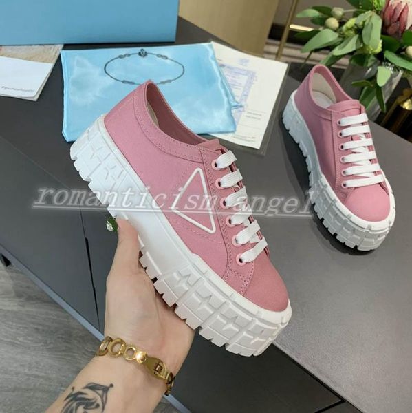 

boy the logo triangle rubber platform inspired by motocross tires defines the unusual design of these nylon gabardine sneakers, Black