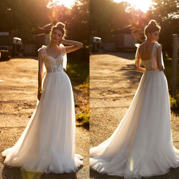 

2021 bohemia wedding dresses spaghetti straps lace appliques bridal gowns custom made backless sweep train a line wedding dress, White