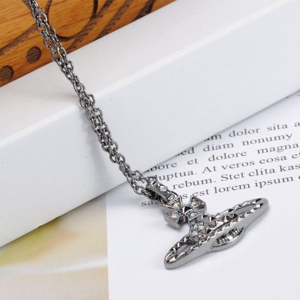 

silver diamond rivet track saturn logo necklace nana necklace