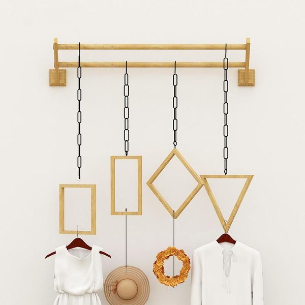 

multifunctional hanger hanging on the wall of display rack in clothing store