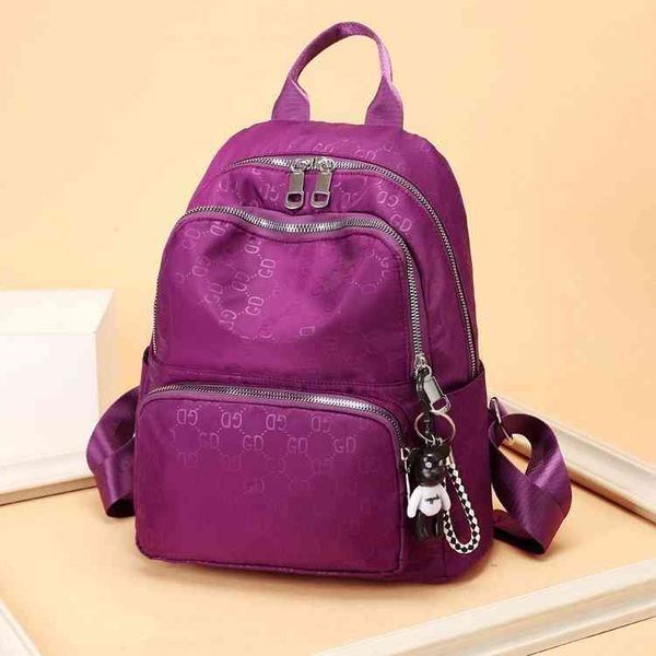 

new college wind embossing color leisure oxford cloth backpack purse