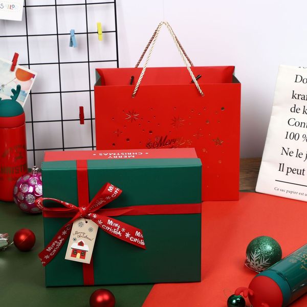 

hand creative and rectangular cover packed with apple christmas gift box
