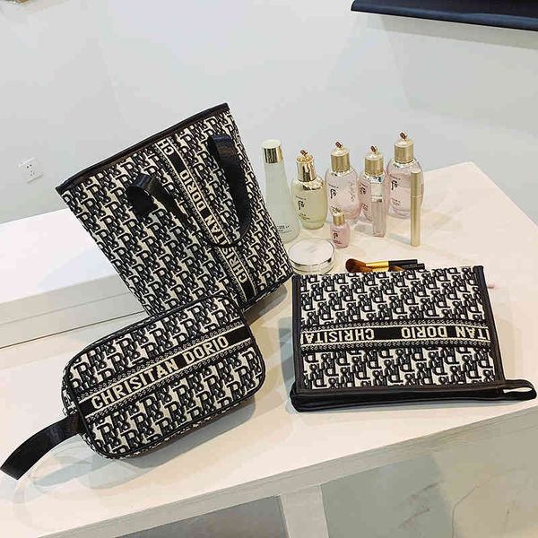 

2022 factory wholesale new make up women's net red super fire multi-functional large capacity washing portable hand bag simple
