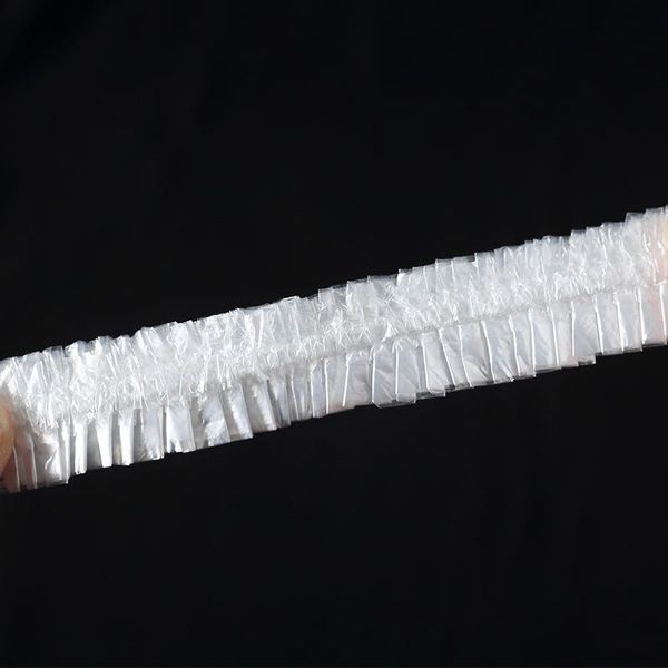 

100 шт. одноразовый пластиковый душ cap водонепроницаемые дамы hat spa hair salon hotel одноразовые купальные эластичные аксессуары для ванн