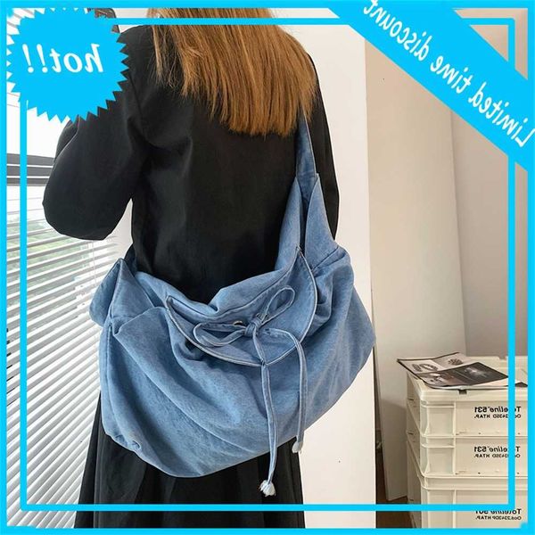 

creative denim solid color large capacity messenger korean casual flip drawstring bag