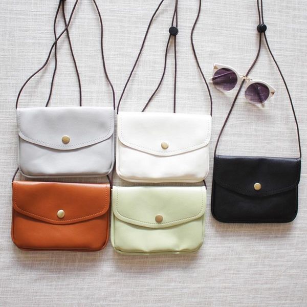 

mobile phone bag slants across small bag, students' wallet