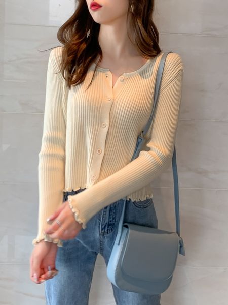 

coat of wool knitted or crocheted long with short sleeves, White;black