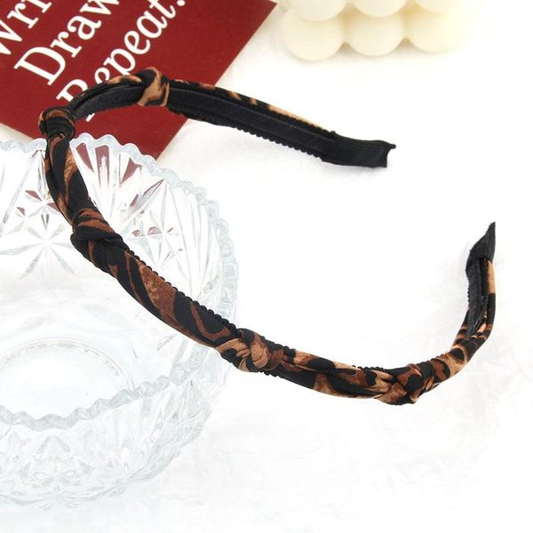 

hair accessories a knotted headband leopard fringe