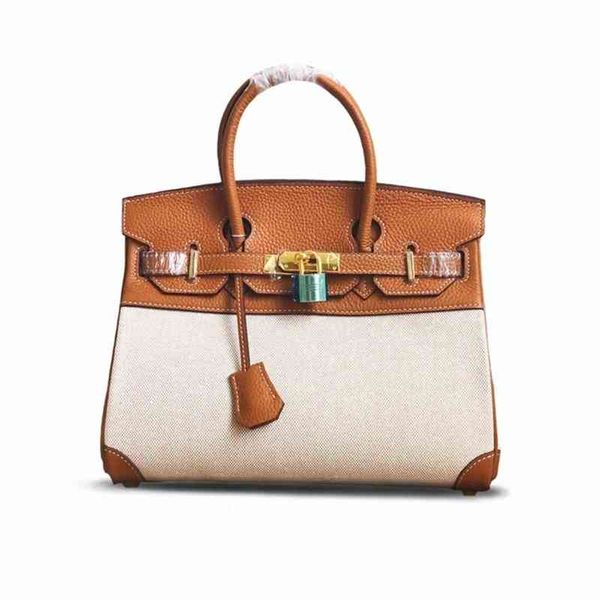 

outlet herme east gate leather splicing contrast canvas single shoulder 30cm portable messenger bag luxuryss bags