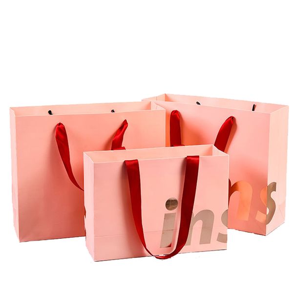Recycelte Tragetasche aus recyceltem Papier mit individuellem Logo-Aufdruck, Einkaufstasche aus rosafarbenem Papier mit mattem Finish und Griff aus Ripsband