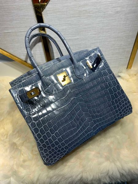 

by order,fully handmade wax thread,shinny crocodile purse30cm,wholesale price,can make other size,many colors for chosen,fast delivery