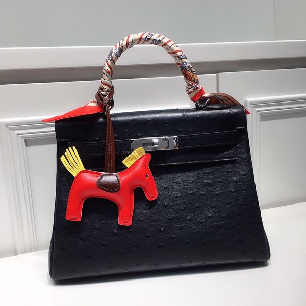 

wholesale price fully handmadequality,28cm,real ostrich skin,design purse,wax stitching,usurally by order only,contact for discoun