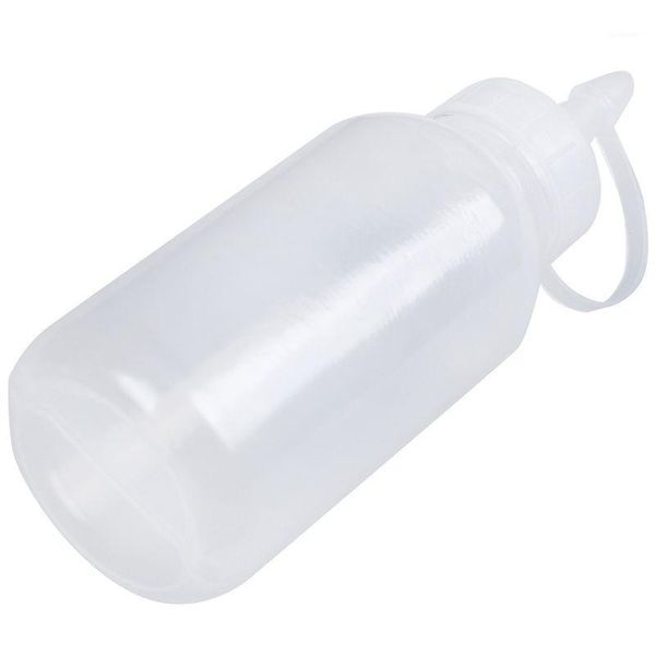 

sewing machine oil bottle made of clear, white plastic 100ml spray nozzle1