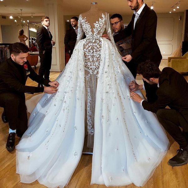 

gorgeous beaded overskirt wedding dresses sheer deep v neck a line 3d appliqued long sleeves bridal gowns sequined tulle robe de mariée, White