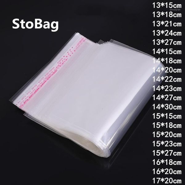 

stobag 100pcs clear plastic self adhesive bag cloth sock gift jewelry accessories candy bag home decor opp cookie packaging1