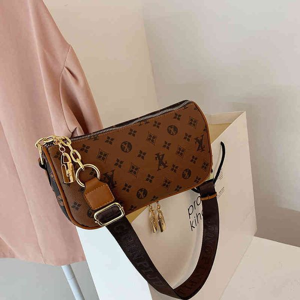

2022 factory outlet net red old flower female new foreign style fashion wide belt single shoulder versatile large capacity messenger bag yzi