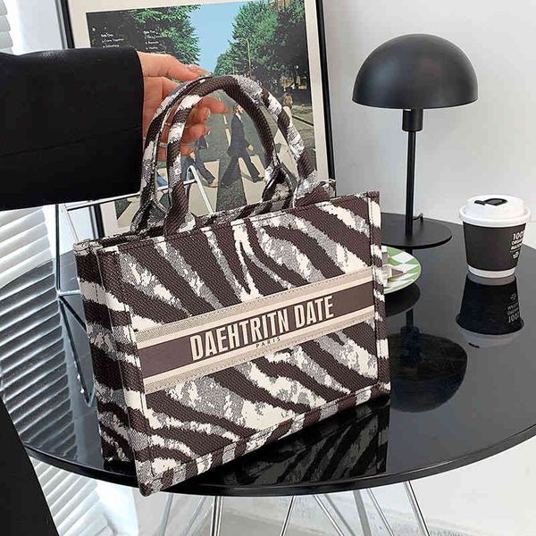 

2022 factory wholesale new net red fashion winter portable women's bag personalized zebra pattern large capacity versatile tote bag