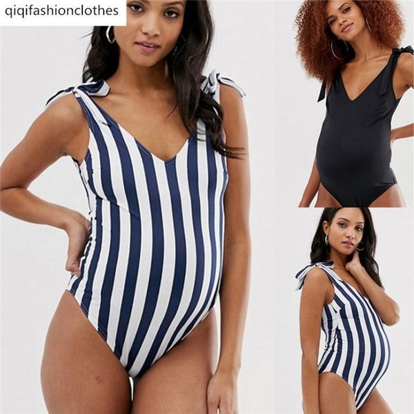 

single striped pregnant woman with bare belly and thin body, White;black