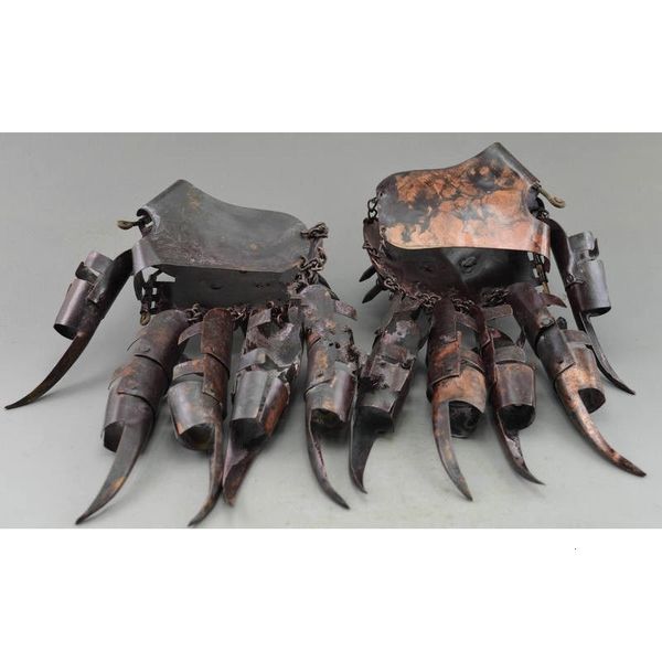 

collectibles decorated old copper hammered protective gloves ancient in war