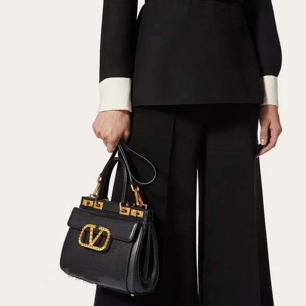 

new rockstud alcove accessories medium hand-held cross-body bag fashion avant-garde modelling to create a unique attractive charm