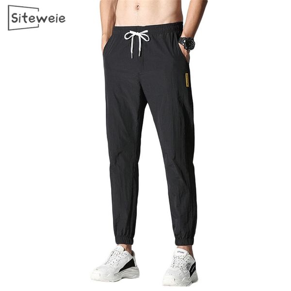 

siteweie men's casual sport pants ice cool quick drying pants lightweight pencil pants men's breathable trousers l304 201218, Black