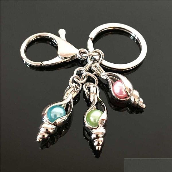

popular conch and pearl cage key ring in europe and america can open key ring with hollow pearl noctilucent pearl volcanic stone 9hzs7, Silver
