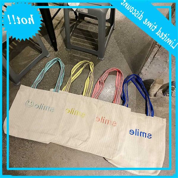 

1119 korean embroidery smiling face large capacity single hair ball shoulder belt student class girl canvas bag
