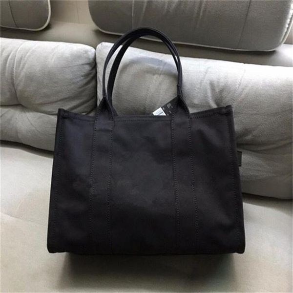 

2020 new fashion trend, versatile, niche design canvas tote bag, cowhide with fabric wide shoulder belt women's shopping bag