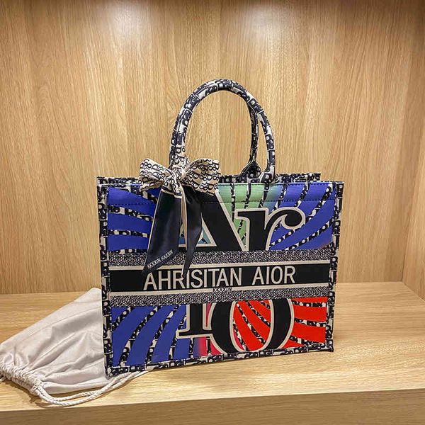

2022 latest models handbag wholesale style large capacity one shoulder summer red same graffiti women's bag