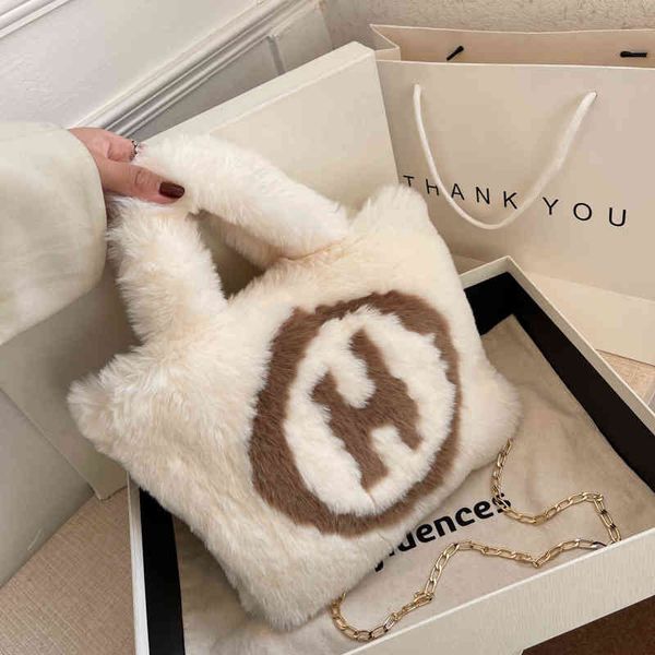 

2022 factory wholesale autumn and winter new popular hand plush bucket letter contrast color single shoulder women's bag