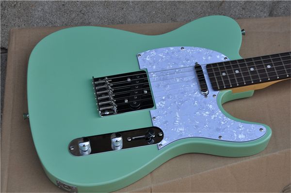 

6 strings green electric guitar with white pearled pickguard guitars