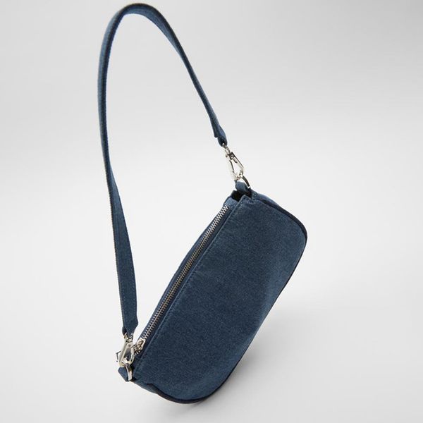 

female fashion and luxury purse designer bag from armpits of the blue vintage denim crossbody shoulder sack for
