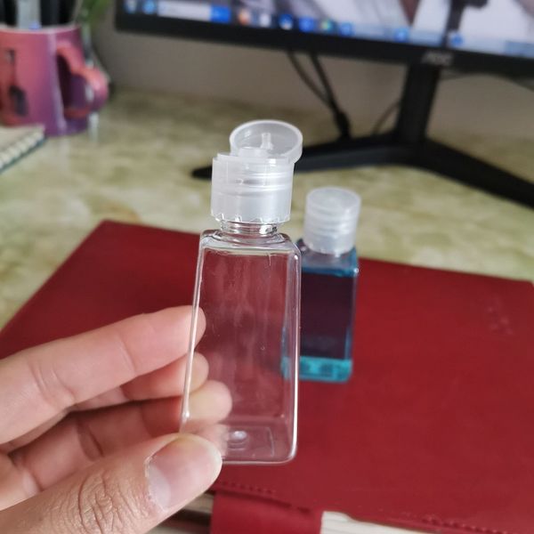 

with hand sanitizer pet plastic 60ml empty flip cap trapezoid shape bottle for makeup fluid disinfectant liquid