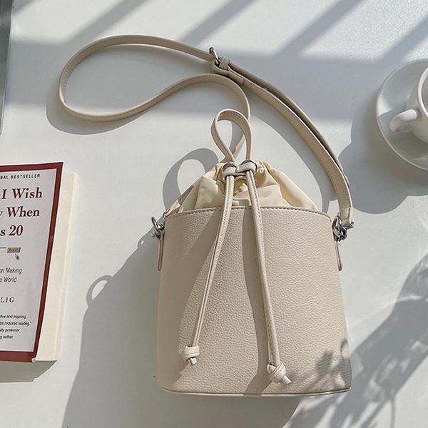 

nylon stitching pu women's bucket bag retro drawstring handbag for ladies niche design female shoulder bag and crossbody