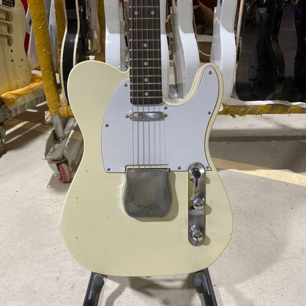 

custom te relic electric guitar with chrome hardware in cream yellow color