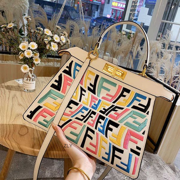 

2021 early spring new women's bag candy seven color denim three dimensional embroidery one shoulder slant cross portable kittenzly