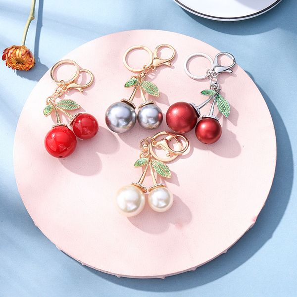 

Souvenirs Creative Korean Pearl Cherry Metal Keychain Fruit Car Bag Pendant