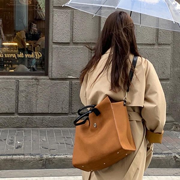 

evening bags heymaymay "street corner story" is matched with the frosted suede brown buckle messenger bag in autumn and winter.