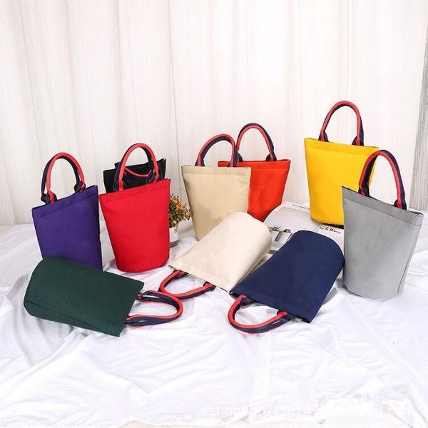 

evening bags 2021 korean version of the barrel built-in water cup lunch bag mummy ladies portable canvas bag.