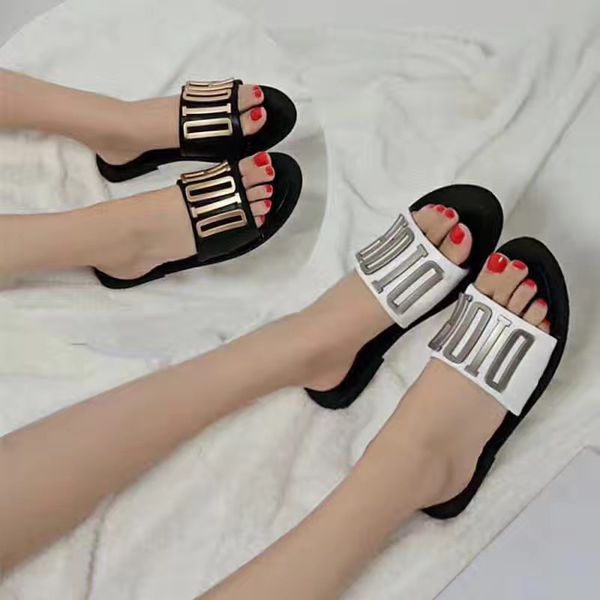 

slippers d home 2021 comfortable one line with fashionable slippers women's summer metal button letters wear flat bottomed leather beac, Black