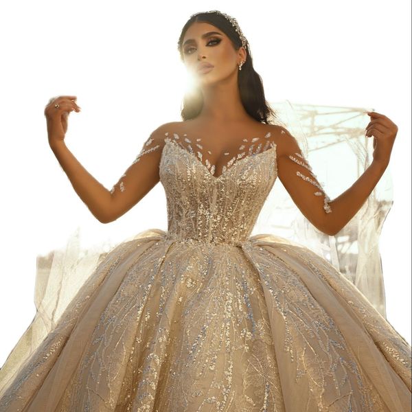 Abiti da sposa di lusso con abito da ballo di Dubai Abiti da sposa con applicazioni di pizzo Taglie forti Abiti da sposa con perline di cristallo a maniche lunghe