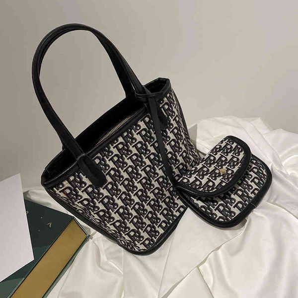 

2022 factory wholesale new embroidered canvas portable women's chaocai basket single shoulder armpit mother's small bag bucket bag