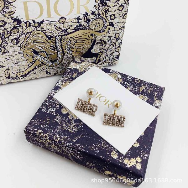 

2021 new designer products of family do letter back hanging star earrings, Golden