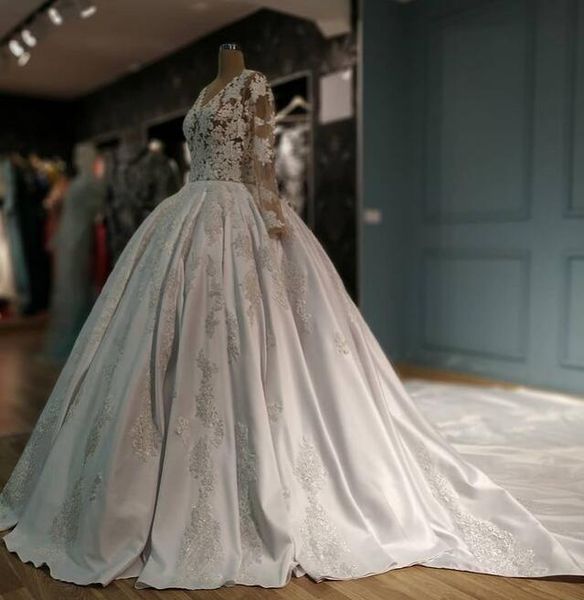 

charming lace v neck wedding dresses sheer long sleeves bridal ball gowns back covered buttons sweep train vestido de novia, White