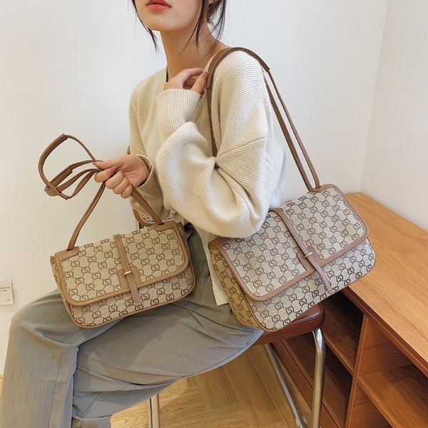 

foreign style hand-held cloth bag women's new one shoulder messenger in early autumn 2021 fashion old flower drawing belt wandering