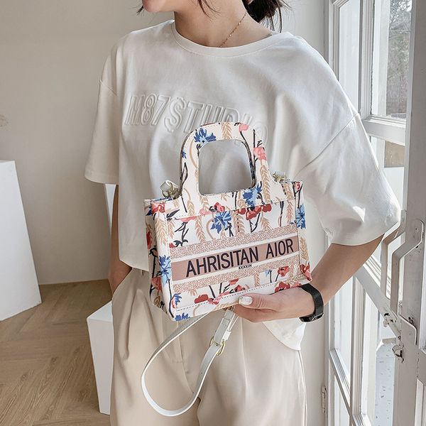 

this year's popular new summer portable small square letter flower printing fashion straddle canvas bag