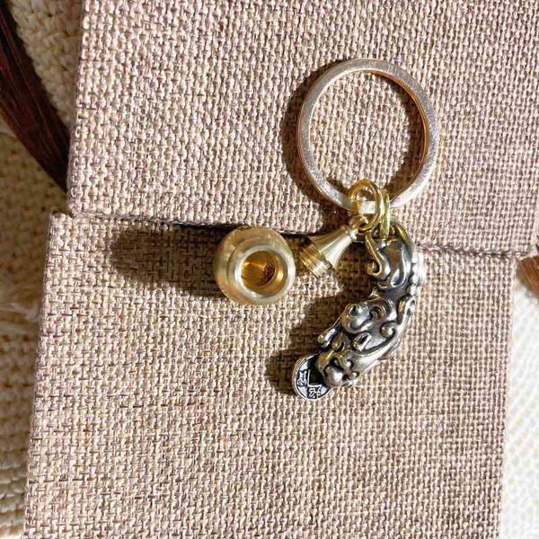 

keychains brass bite money, open gourd (engravable pattern) and vermilion powder live blasting key chain, Silver